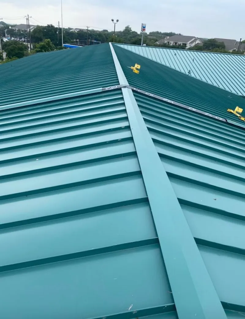 Green commercial metal roof ridge and valley for Metal Roof Repair in Trinity